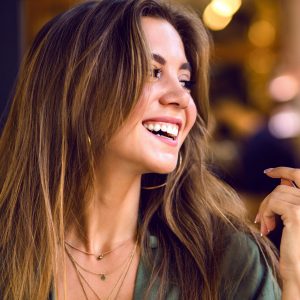 Close up portrait of portrait magnificent young sensual model with long brown hairs and shy cute smile, natural pure beauty, soft make up .